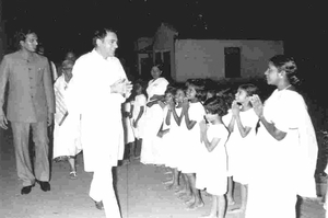 Children greet Prime Minister Rajiv Gandhi on his private visit to Bala Mandir