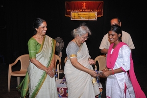 Chief Guest presenting certificates for Academic excellence